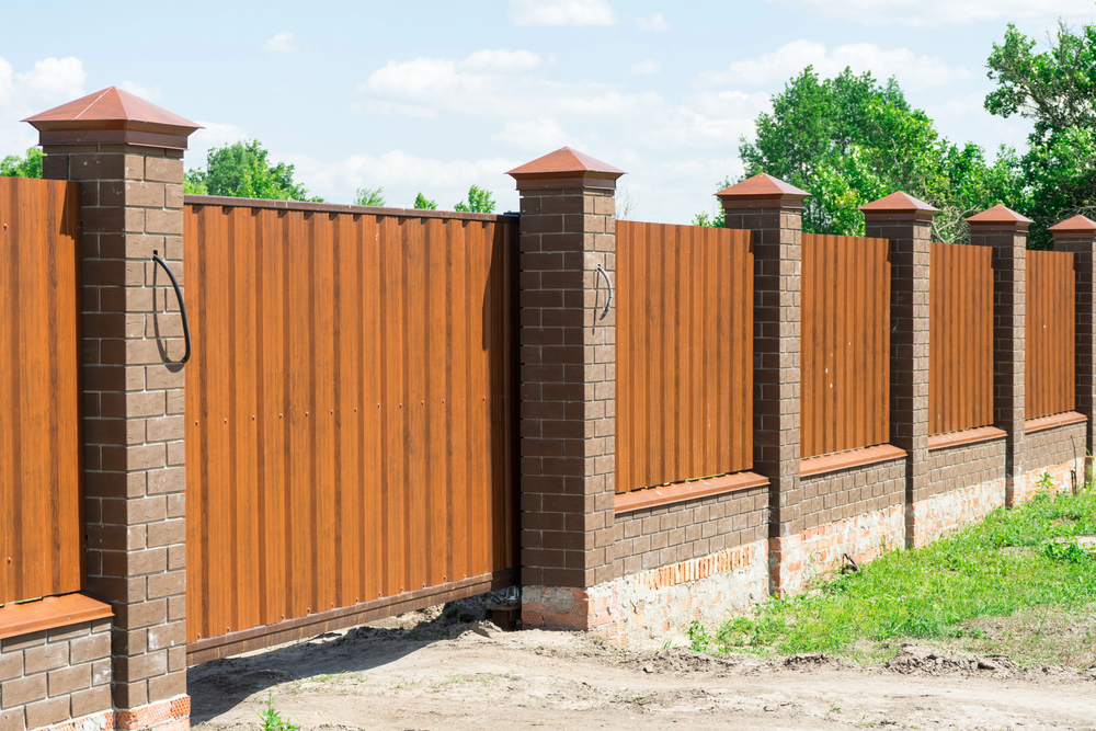 Comparing The Cost Of Metal Fences Vs. Wood Fences: Pros And Cons